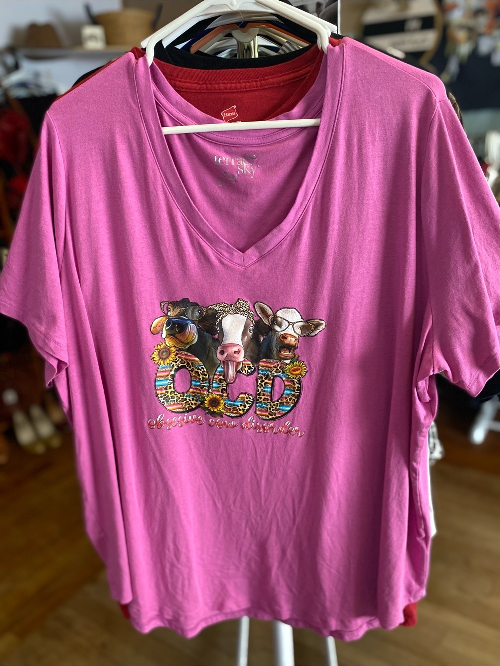 Terra & Sky Pink V‑Neck Tee with Colorful Cow Graphic